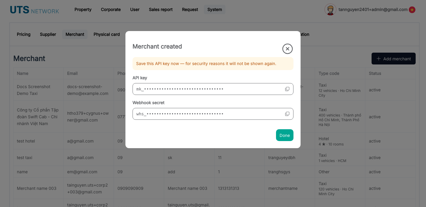 Khung "Merchant created" hiển thị một lần, gồm API key và webhook secret, mỗi ô có nút sao chép